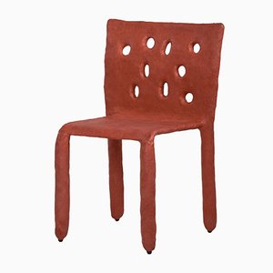 Silla esculpida en naranja de Victoria Yakusha