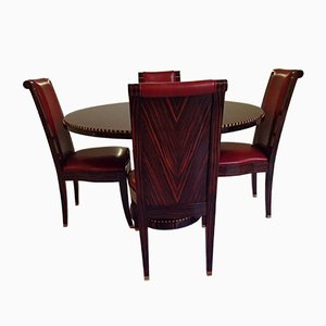 Mesa de comedor y sillas de cuero rojo, años 80. Juego de 5