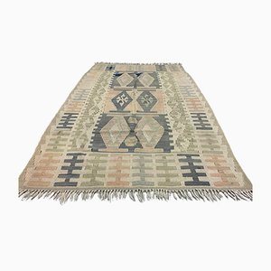 Alfombra Kilim turca vintage mediana de lana en relieve de 163x100 cm