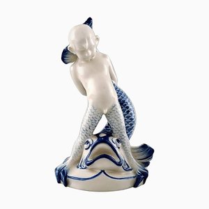 Figura Sea Boy y pez de porcelana de Rörstrand, siglo XX