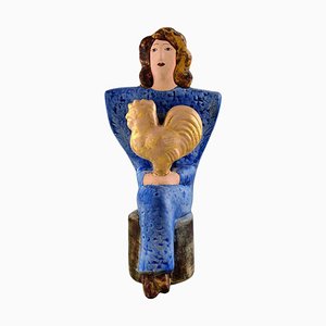 Figurine of Sitting Woman in Blue with Golden Rooster by Lisa Larson