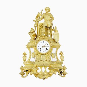 Reloj de repisa en forma de estatuilla de mármol y bronce dorado, siglo XIX