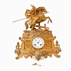 Reloj Imperio francés antiguo con péndulo de bronce dorado