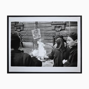 Hungary Uprising in Back a Fire with a Poster of Istvan Dobi, 1956
