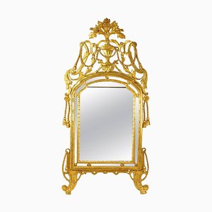 Espejo italiano grande de madera dorada tallada con decoración de cuerda y borlas, siglo XVIII