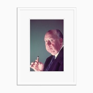 Alfred Hitchcock Holding A Cigar Framed in White by Baron