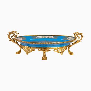 Taza antigua de porcelana Sèvres y bronce dorado