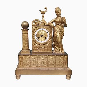 Reloj francés de bronce bañado en oro, siglo XIX