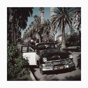 Police Patrolman Oversize C Print Framed in Black by Slim Aarons