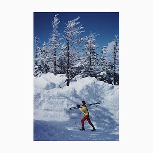 A Skier in Vermont Oversize C Print Framed in Black by Slim Aarons