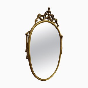 Italian Ornate Carved Giltwood Oval Wall Mirror, 1960s