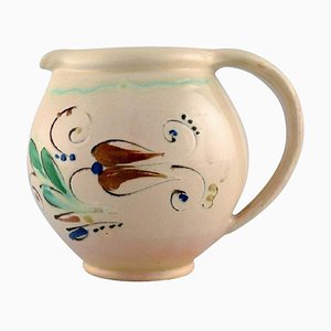 Jug in Glazed Stoneware Flowers on a Cream Colored Background from Kähler HAK