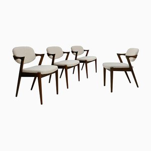 Sillas danesas Mid Century de nogal. Juego de 4