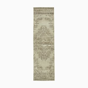 Handgewebter beige anatolischer antiker Teppich in Überfärbung
