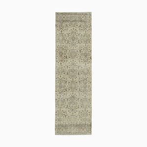 Handgewebter beige anatolischer antiker Teppich in Überfärbung