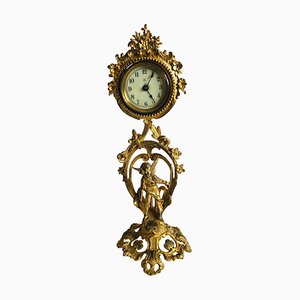 Reloj francés antiguo ornamentado dorado, siglo XIX