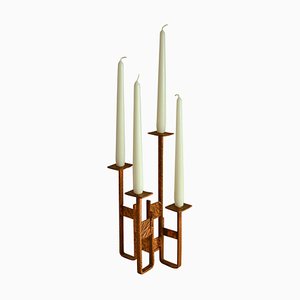 Candelabro de cobre para cuatro velas
