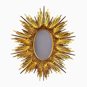 Specchio grande a forma di sole in legno dorato, anni '20
