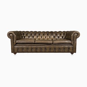 Divano Chesterfield in pelle con sedute abbottonabili, XX secolo