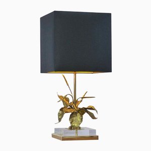 Lámpara de mesa de latón dorado con follaje