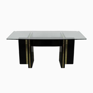 Mesa de comedor Hollywood Regency vintage lacada en negro con borde dorado y tablero de vidrio