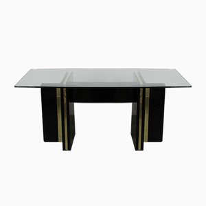 Mesa de comedor Hollywood Regency vintage lacada en negro con borde dorado y tablero de vidrio