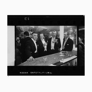 New Year at Romanoff’s Silver Gelatin Fiber Print Framed in Black by Slim Aarons