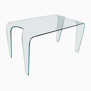 Mesa de comedor grande de vidrio curvado