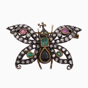 Spilla antica in oro e argento con diamanti, rubini, smeraldi e zaffiri. Art Nouveau