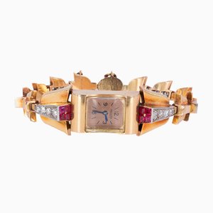 Reloj de pulsera Lady en oro de 18 quilates con diamantes y rubíes de Jaeger, años 30