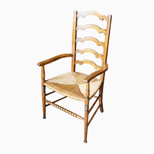 Arts & Crafts Stuhl aus massiver Eiche mit Sprossenlehne und geflochtenem Sitz