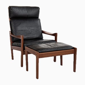 Midcentury Danish lounge chair and ottoman in teak and leather by Illum Wikkelsø for Niels Eilersen
