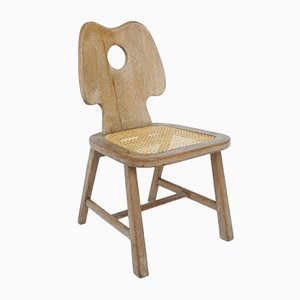 Silla francesa de madera maciza tallada y paja vienesa al estilo de Jean Royère