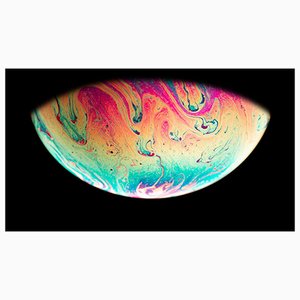 Torriphoto, planeta colorido abstracto sobre fondo negro, papel fotográfico