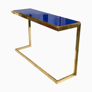 Mesa consola de latón con tablero de vidrio azul