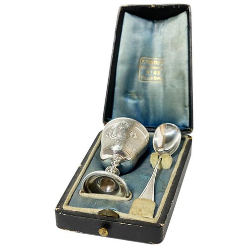 Antique silver egg shop cup and spoon set