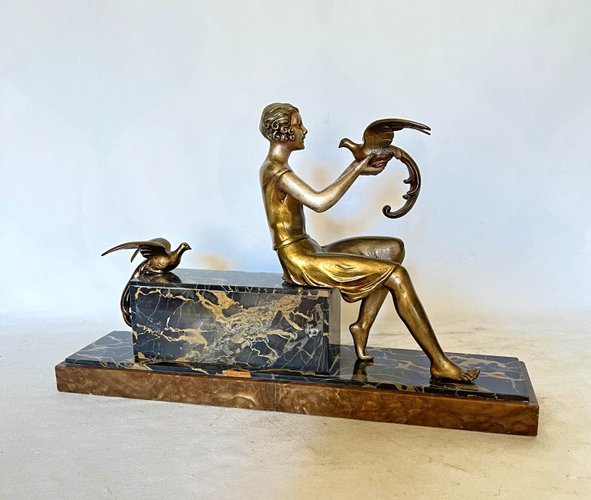 Art Deco Sculpture of Young Woman with Birds of Paradise from d