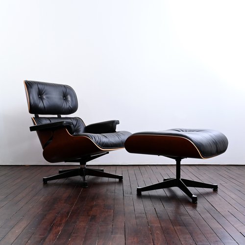 Lounge Chair with Foot Rest in Santos Rosewood by Charles & Ray Eames