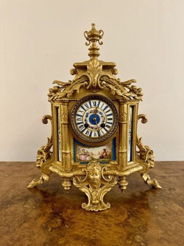 Orologio da camino in metallo dorato e porcellana, Francia, XIX