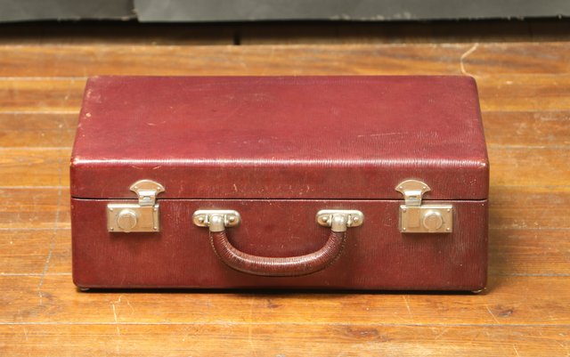 red leather suitcase