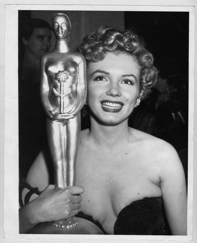 Actress Marilyn Monroe Wins a Trophy Photographed by Earl Leaf