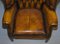 Vintage Chesterfield Porters Ohrensessel aus Braunem Leder 8