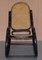 Schwarzer ebonisierter Vintage Bergere Schaukelstuhl aus Rattan von Thonet 2