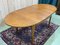 Oval Table in Teak with a Butterfly Length, 1970s 11