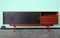 Mid-Century Italian Sideboard or Chest of Drawers with Sliding Black Laminated Doors from Saporiti Italia 1