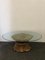 Tavolo con base in ceramica dorata e ripiano in cristallo., Immagine 1
