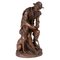 Anatole J. Guillot, Depicting Seated Woodcarver with Dog, Bronze Sculpture, Image 1