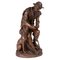 Anatole J. Guillot, Tallador de madera sentado con perro, Escultura de bronce, Imagen 1