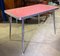 Mesa vintage de formica rosa con estructura de acero, años 50, Imagen 1