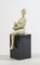 Art Deco Statue of a Woman, White Ceramic with Black Painted Wooden Base 1